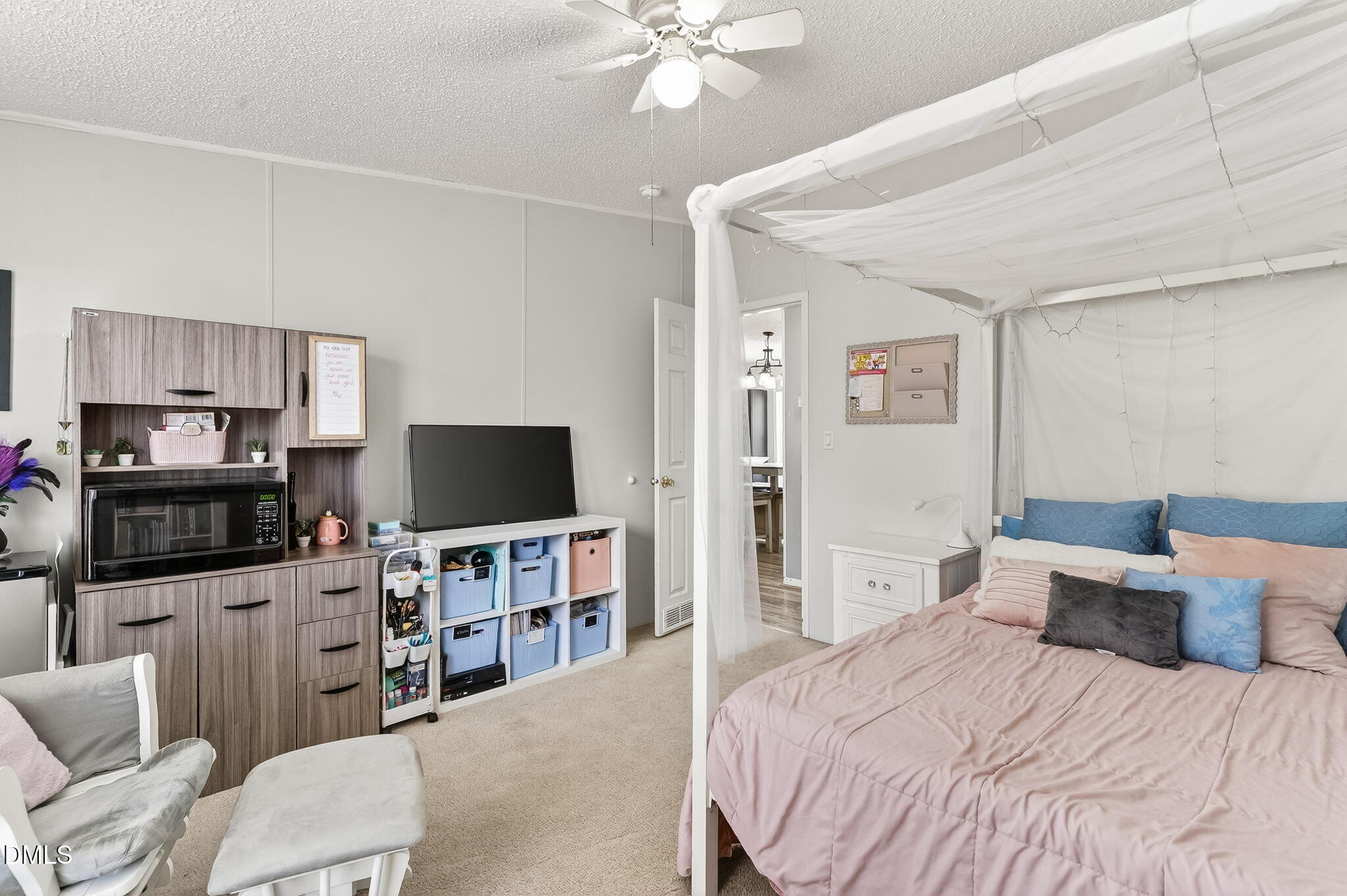 112 Morgan Street Erwin, NC 28339 - Photo 24 of 35 a bedroom with a bed and a flat screen tv