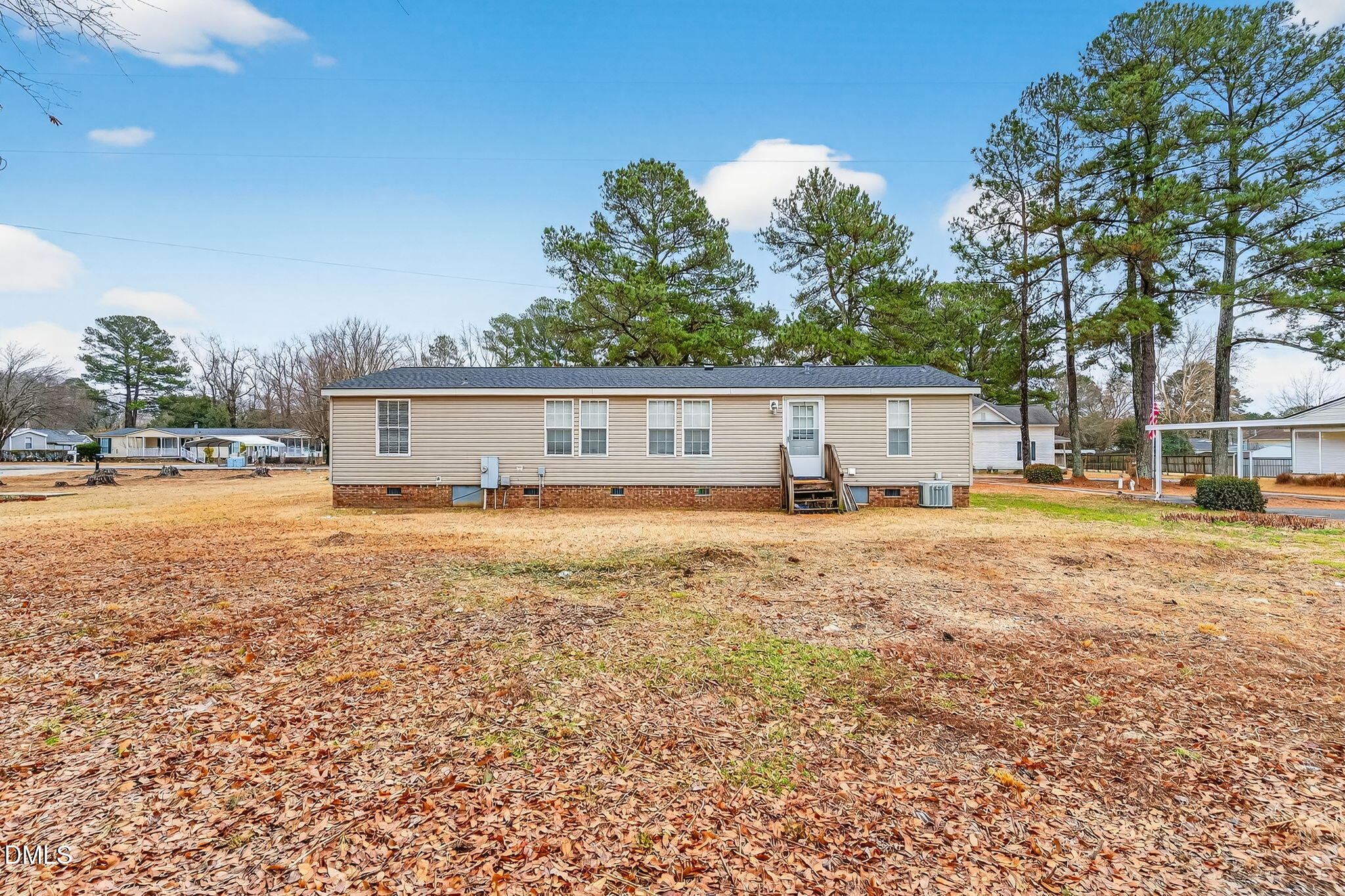 112 Morgan Street Erwin, NC 28339 - Photo 26 of 35 a front view of a house with a yard and trees