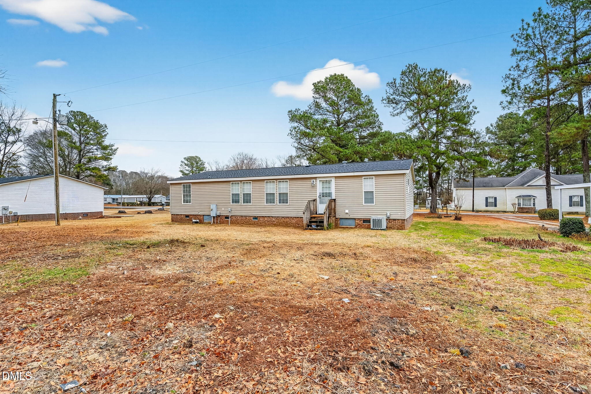 112 Morgan Street Erwin, NC 28339 - Photo 27 of 35 a front view of a house with a yard and trees