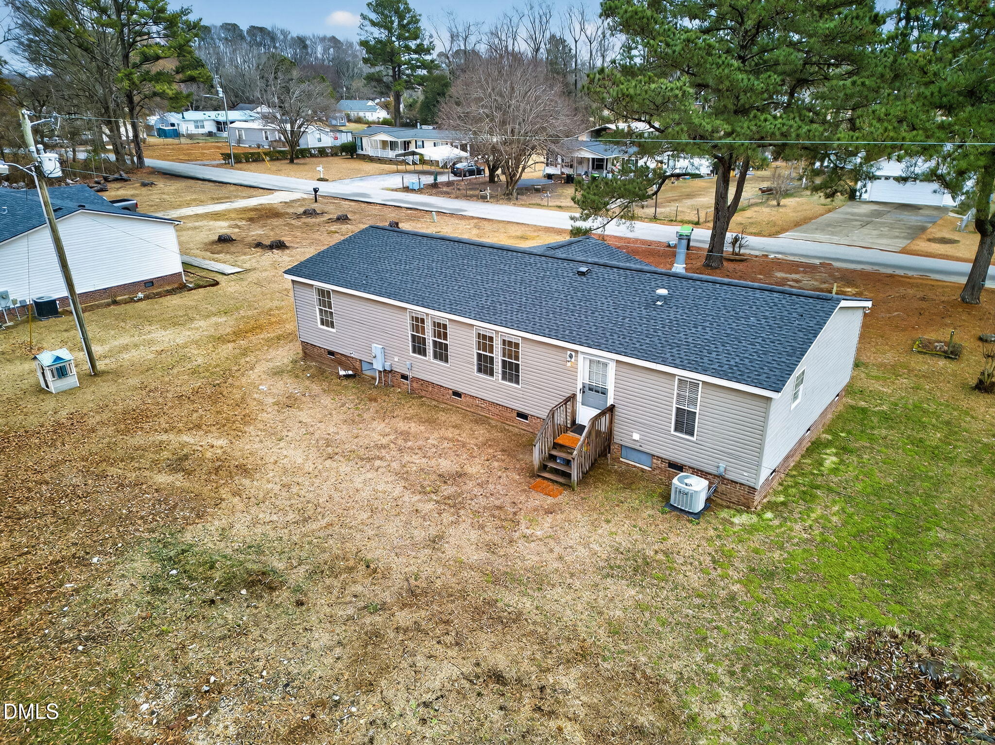 112 Morgan Street Erwin, NC 28339 - Photo 32 of 35 a swimming pool with some trees in the background