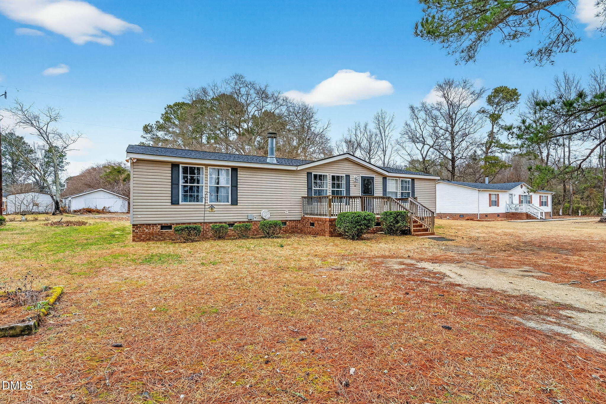 112 Morgan Street Erwin, NC 28339 - Photo 4 of 35 a front view of a house with a yard and lake view