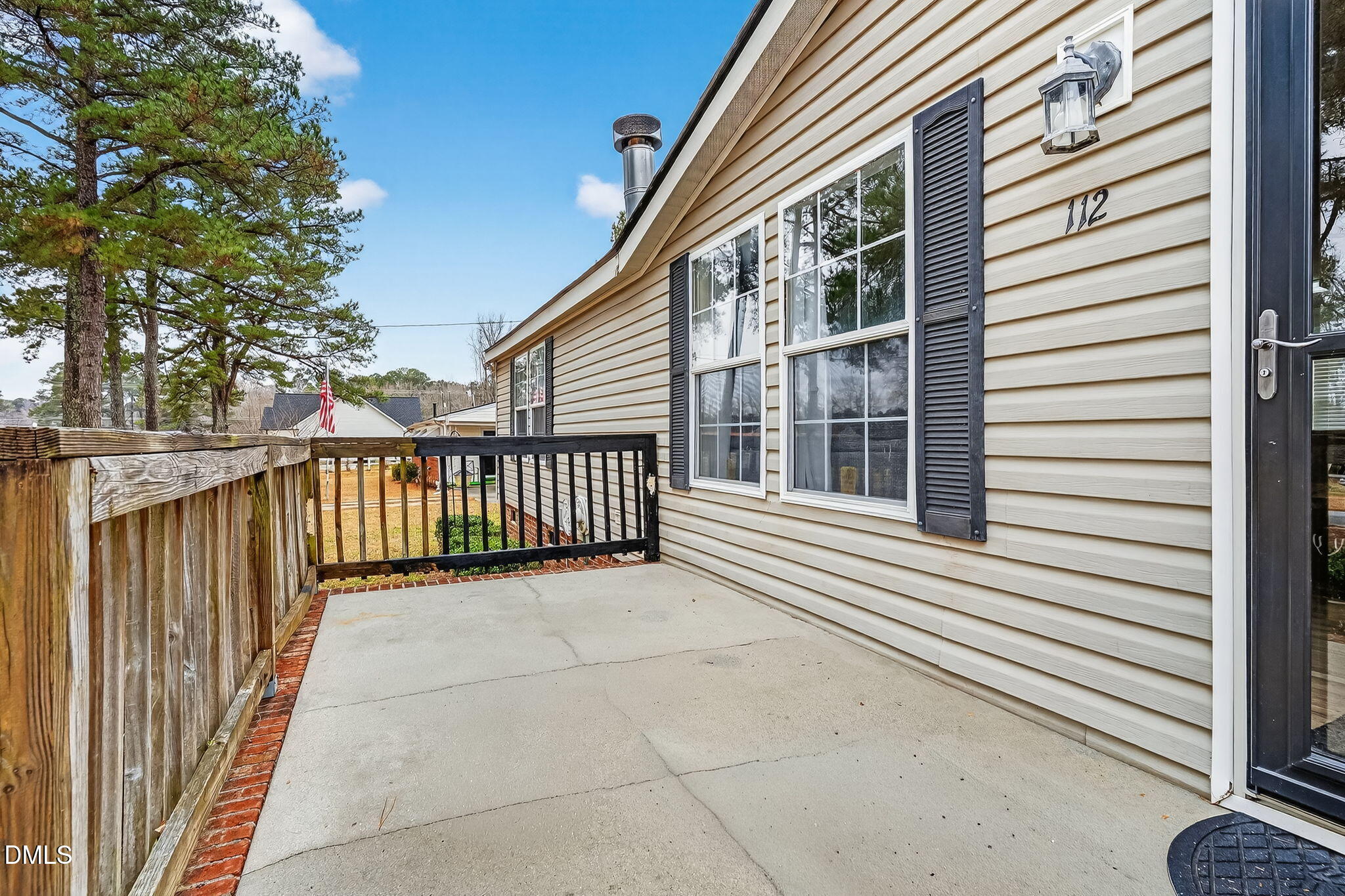 112 Morgan Street Erwin, NC 28339 - Photo 6 of 35 a view of a balcony with a swing