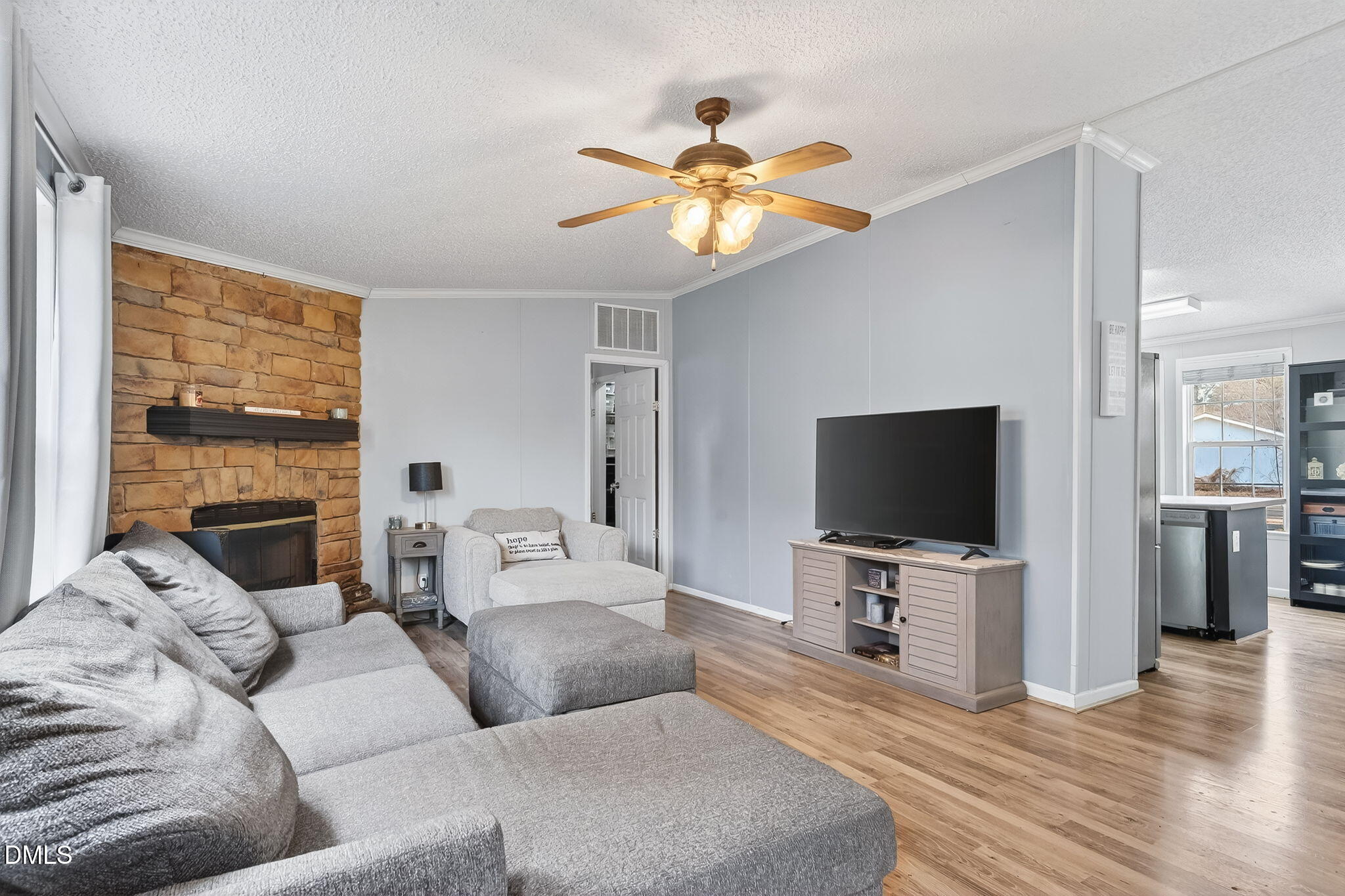 112 Morgan Street Erwin, NC 28339 - Photo 9 of 35 a living room with furniture and a flat screen tv