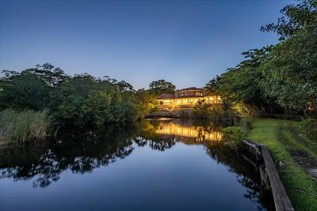 a view of a swimming pool with a patio and yard