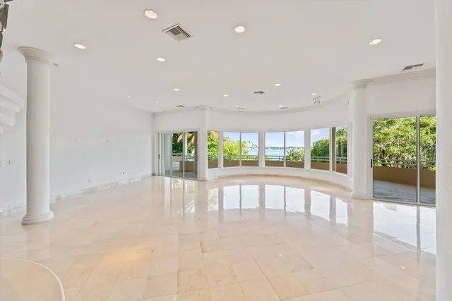 a very nice looking dining room with a large window