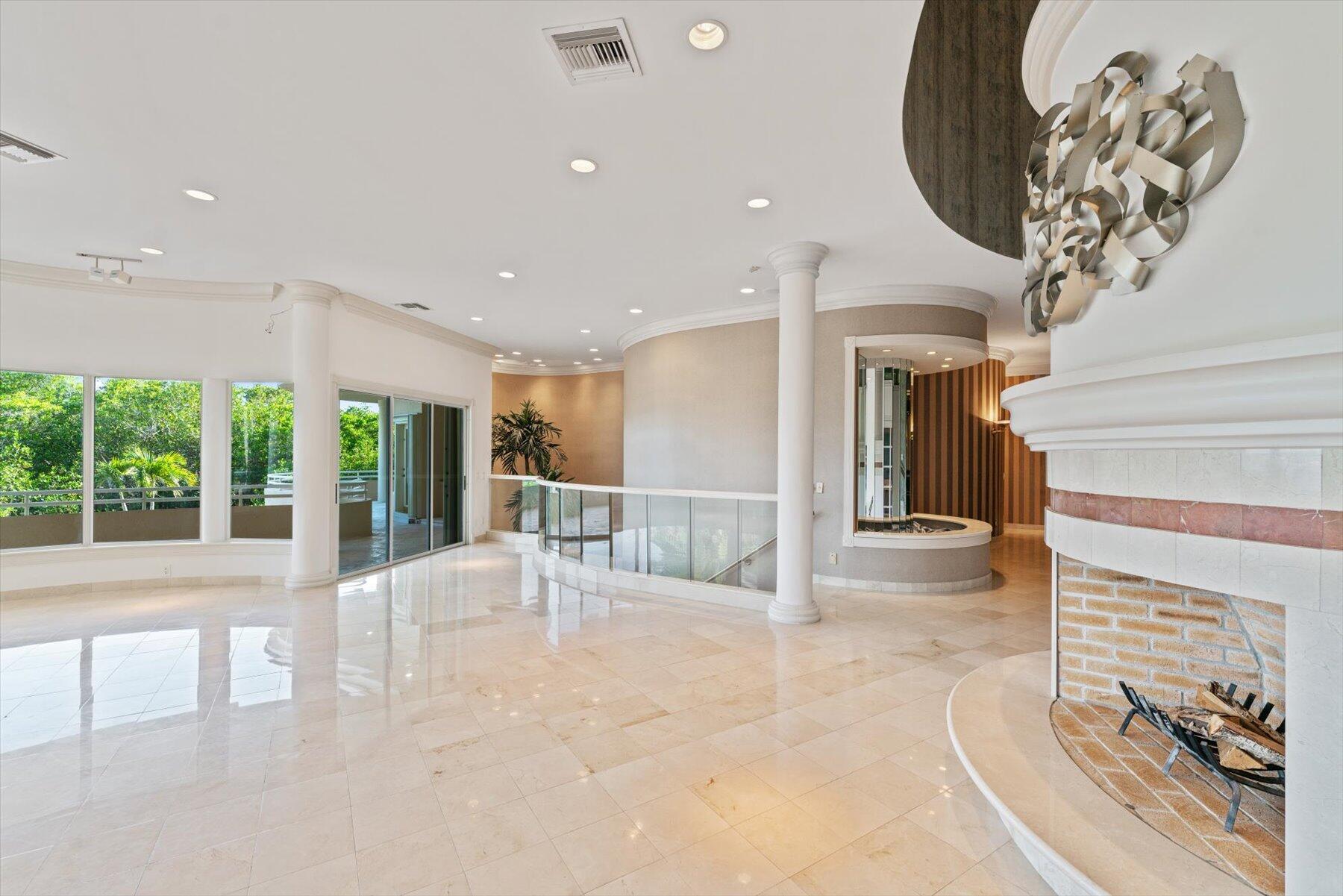 49 West High Point Road Sewall's Point, FL 34996 - Photo 17 of 99 a view of a livingroom with furniture and floor to ceiling window