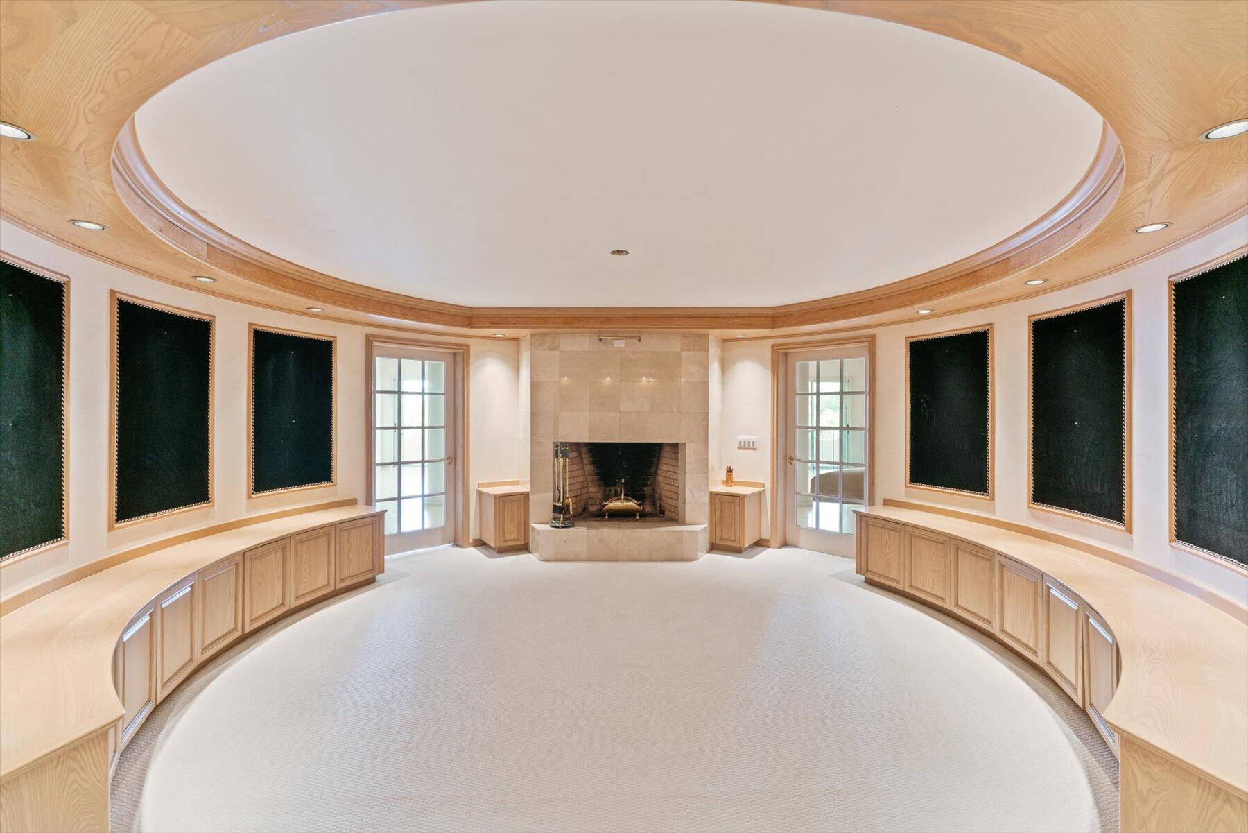 49 West High Point Road Sewall's Point, FL 34996 - Photo 21 of 99 a view of an empty room with a fireplace and a large window