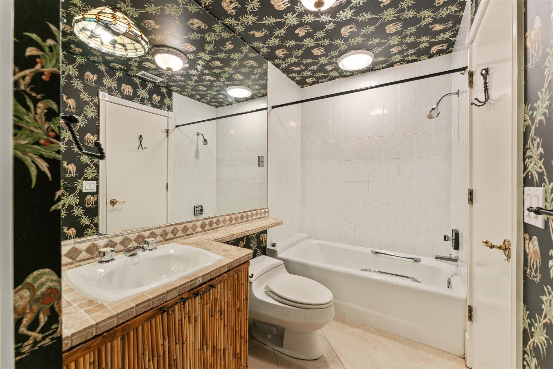 49 West High Point Road Sewall's Point, FL 34996 - Photo 43 of 99 a bathroom with a sink a toilet and shower