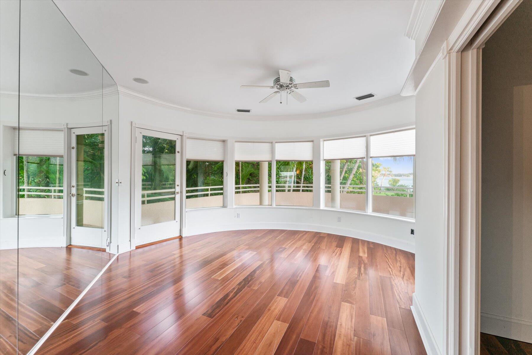 49 West High Point Road Sewall's Point, FL 34996 - Photo 49 of 99 a view of empty room with wooden floor and fan