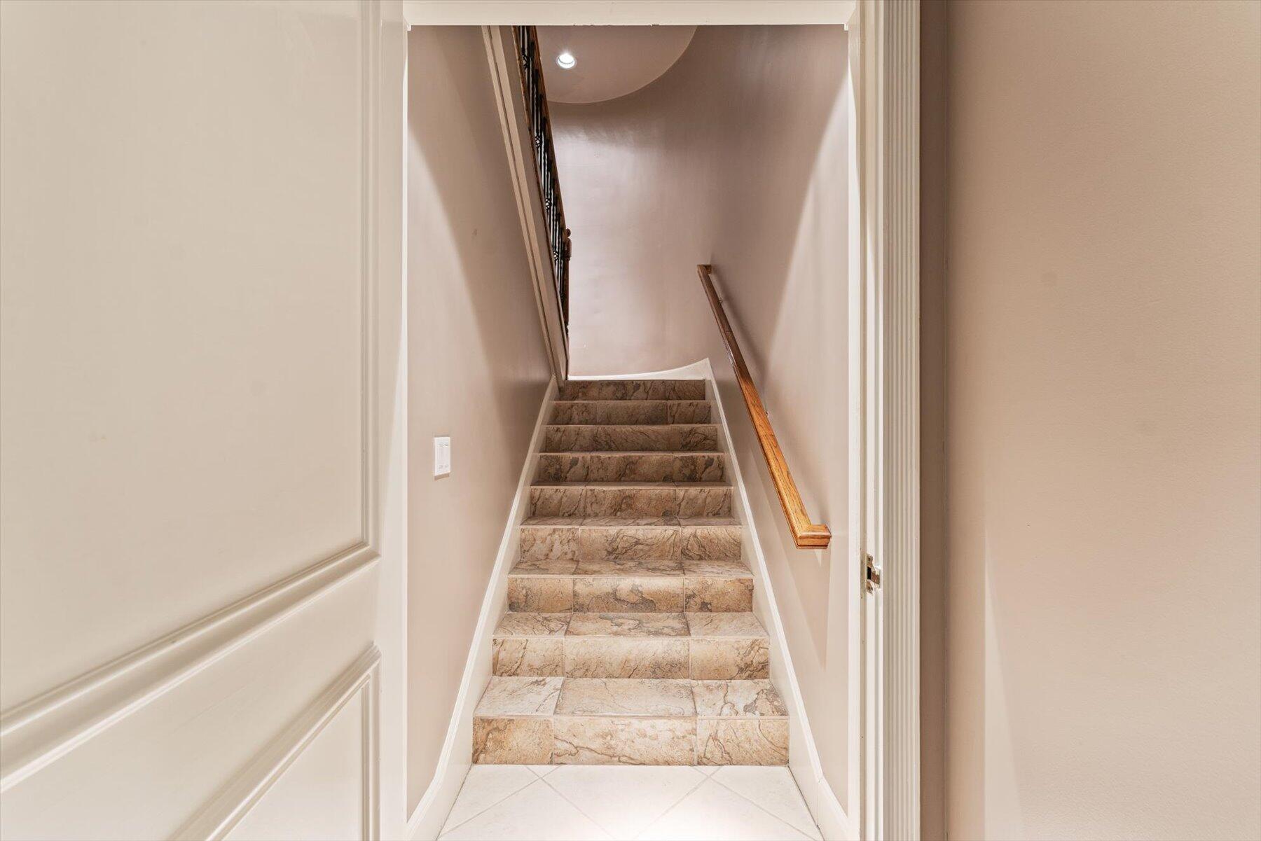 49 West High Point Road Sewall's Point, FL 34996 - Photo 53 of 99 a view of staircase with white walls and white walls