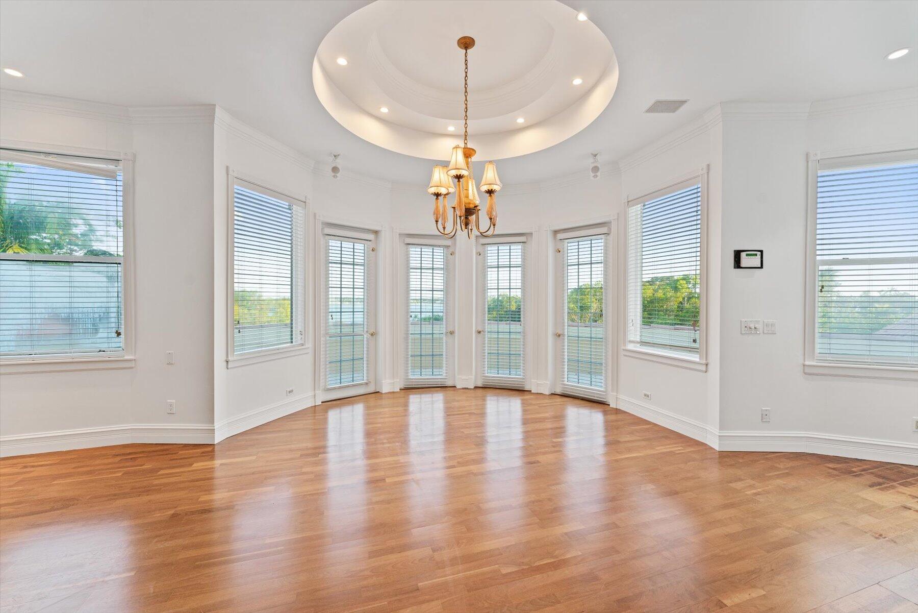 49 West High Point Road Sewall's Point, FL 34996 - Photo 55 of 99 a view of an empty room with wooden floor and a window