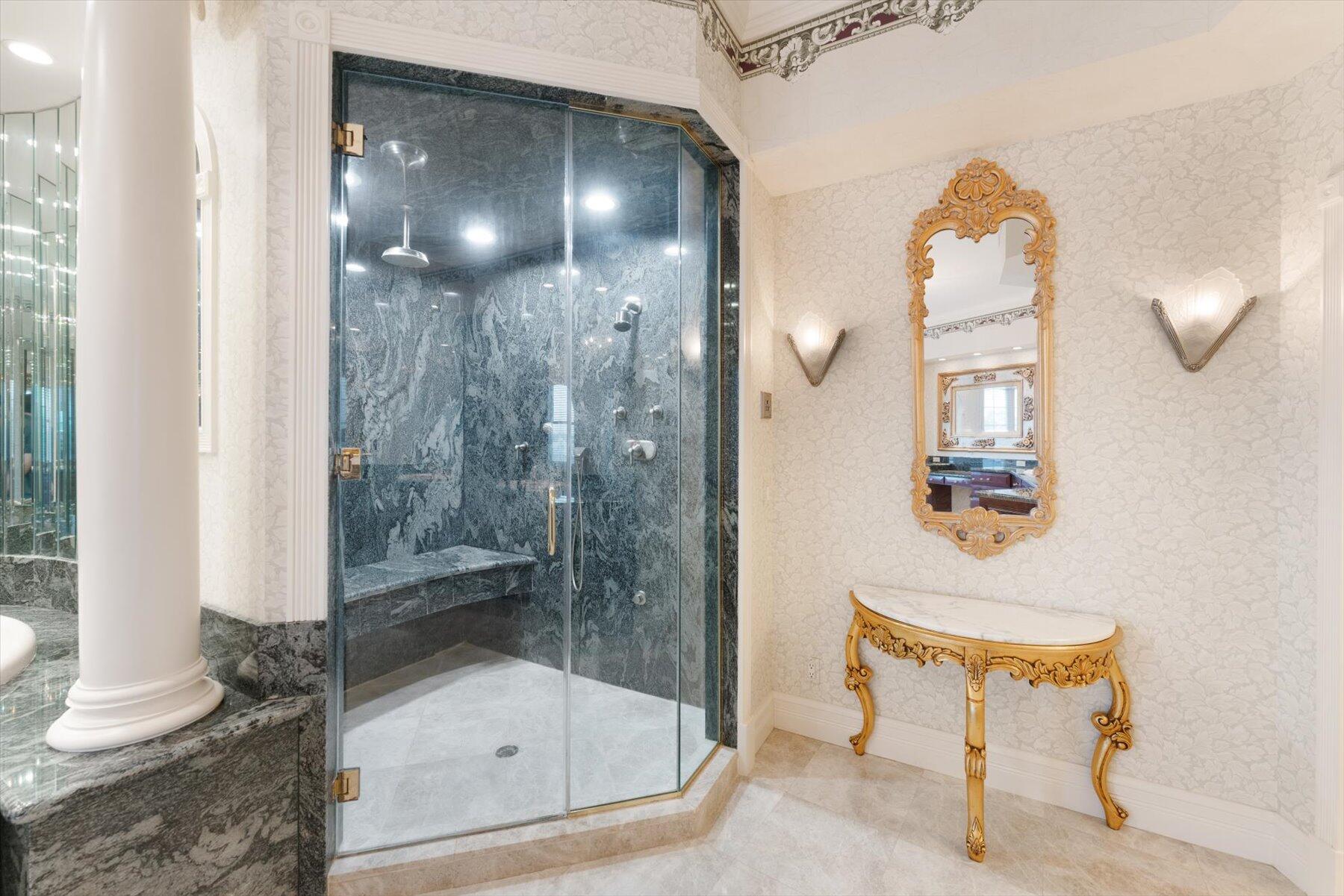 49 West High Point Road Sewall's Point, FL 34996 - Photo 61 of 99 a bathroom with a shower a mirror and a sink