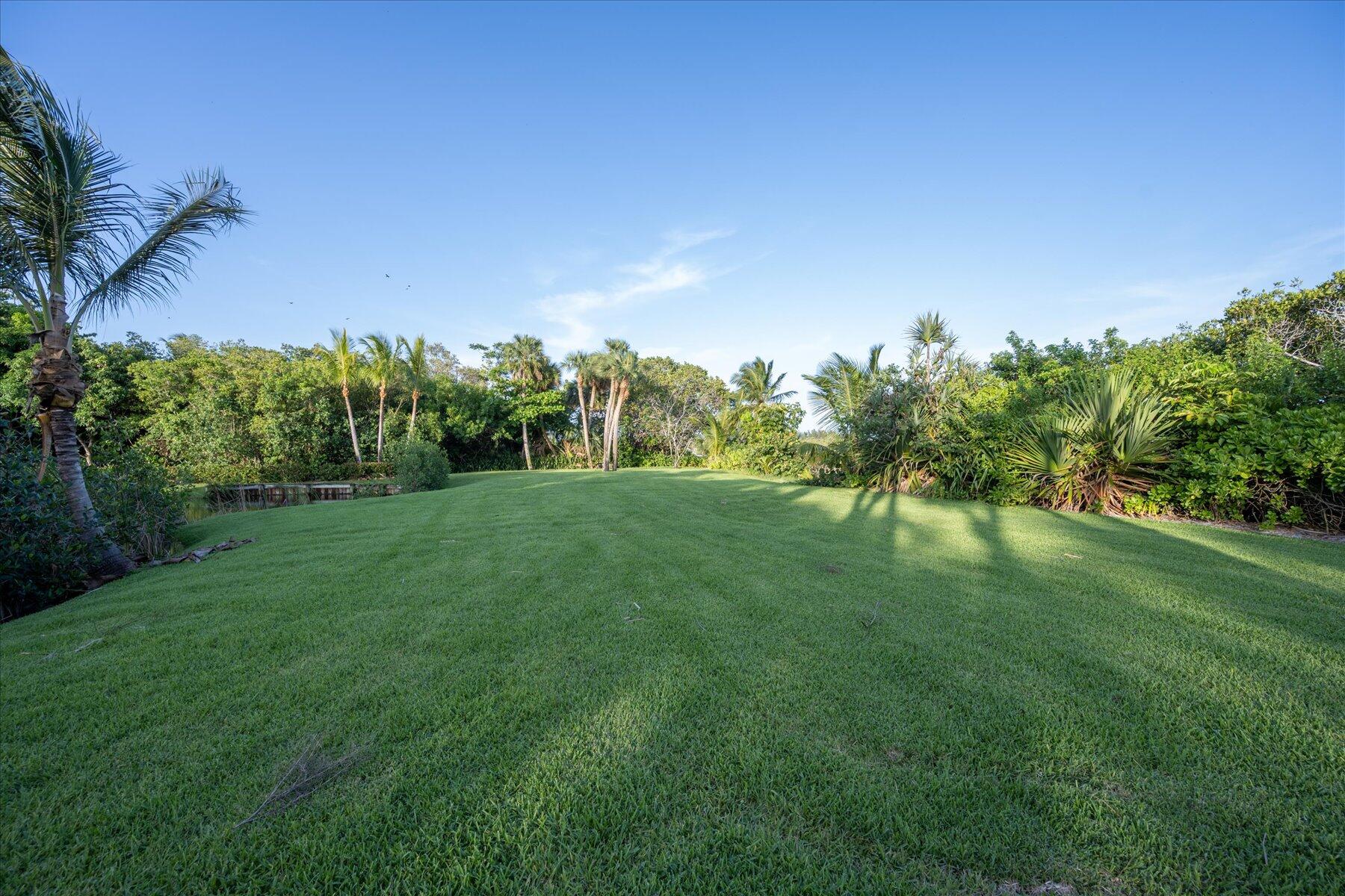 49 West High Point Road Sewall's Point, FL 34996 - Photo 78 of 99 a yard with lots of green space and mountain view