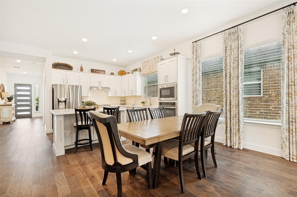 229 Savannah Lane Oak Point, TX 75068 - Photo 6 of 26 a dining room with furniture and wooden floor