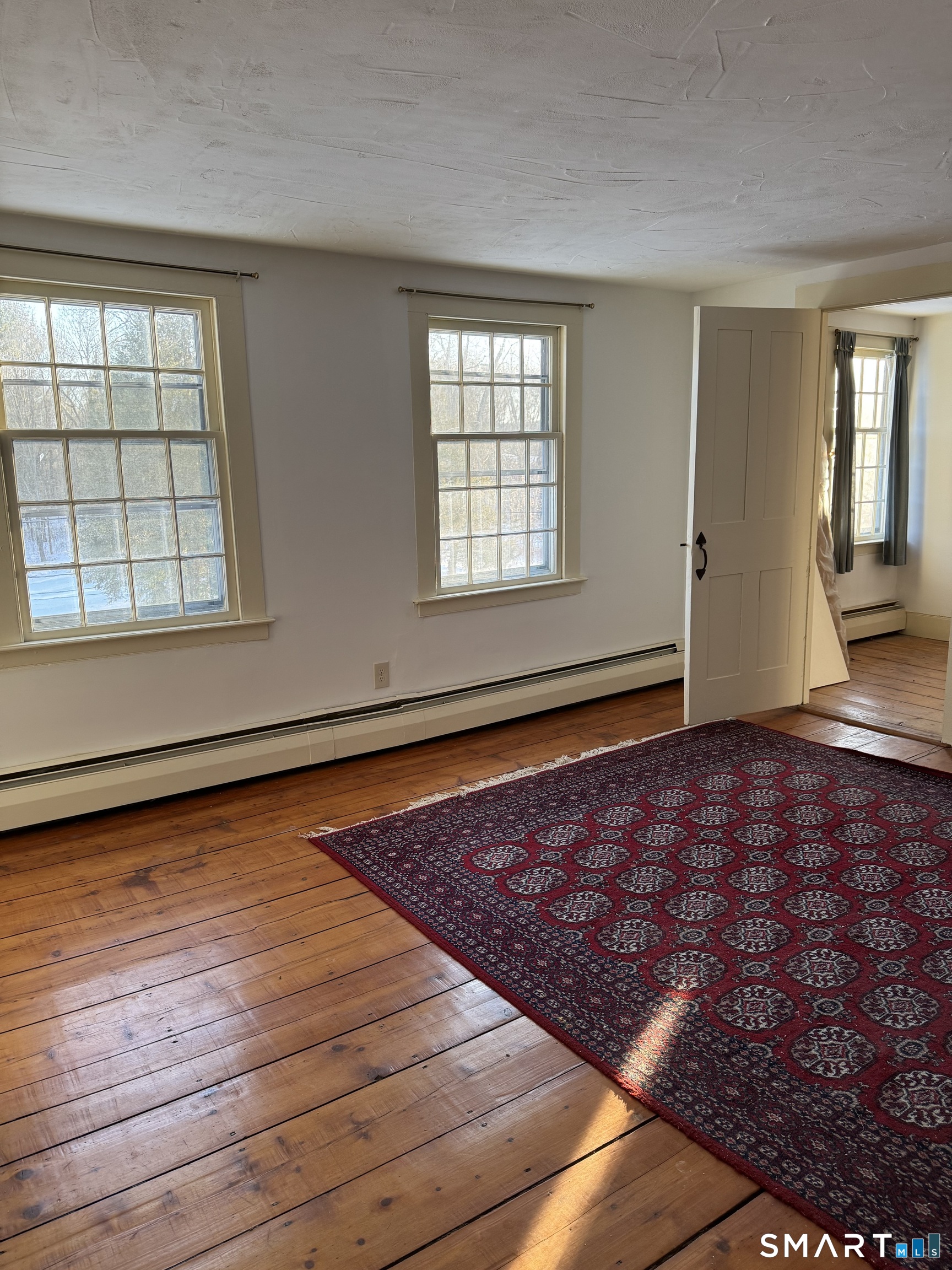 30 Hopyard Road East Haddam, CT 06423 - Photo 12 of 42 a view of an empty room with wooden floor and a window