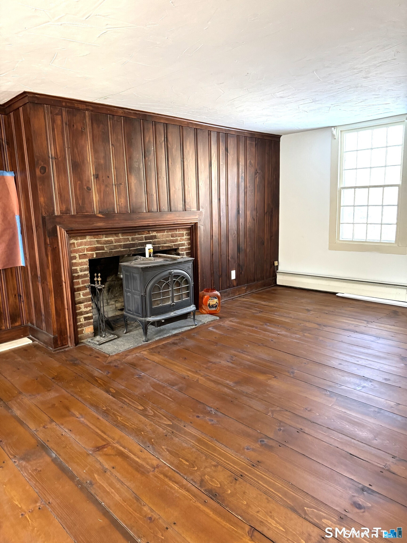 30 Hopyard Road East Haddam, CT 06423 - Photo 35 of 42 an empty room with wooden floor fireplace and windows