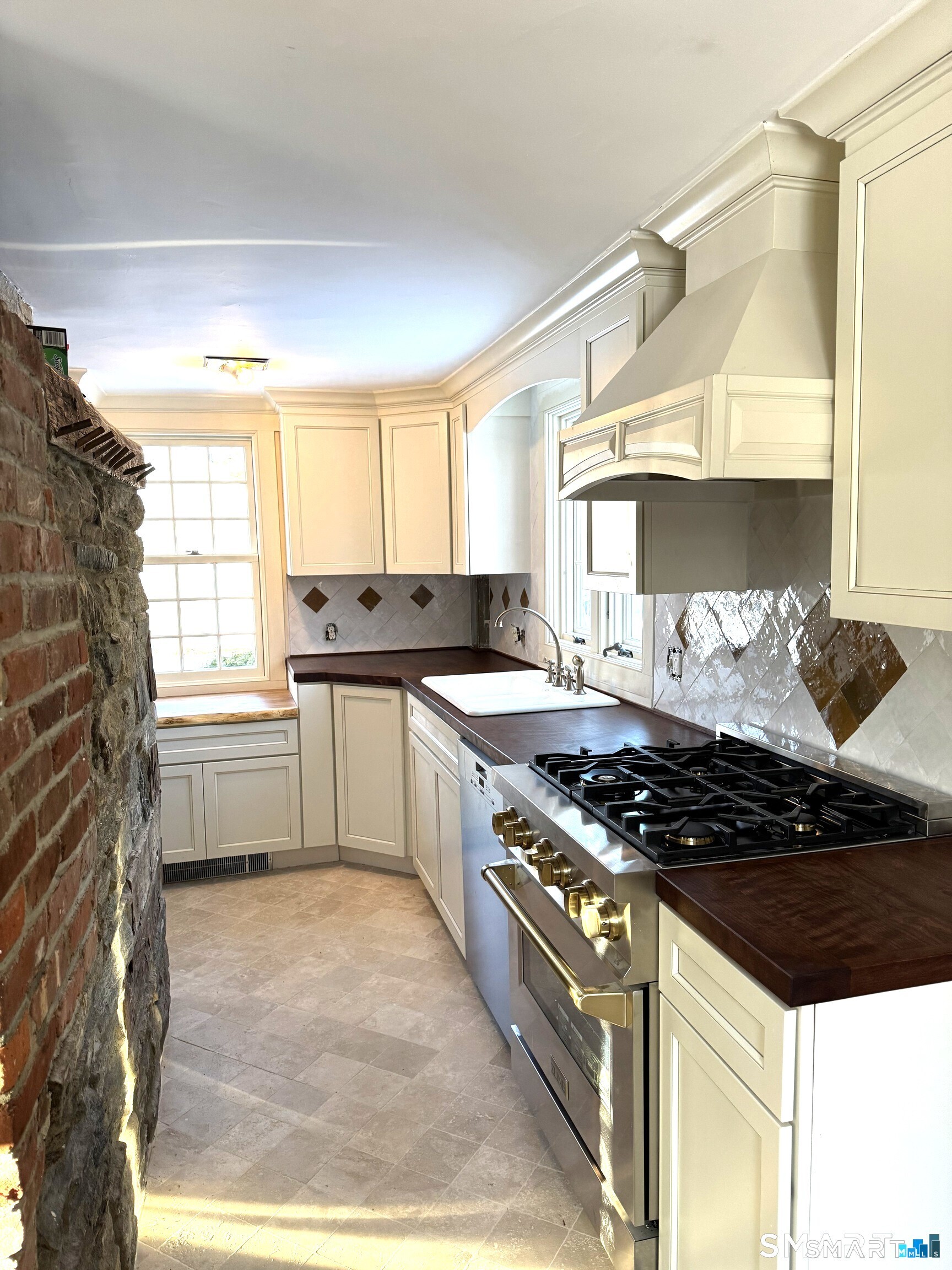 30 Hopyard Road East Haddam, CT 06423 - Photo 39 of 42 a kitchen with granite countertop a stove and a sink