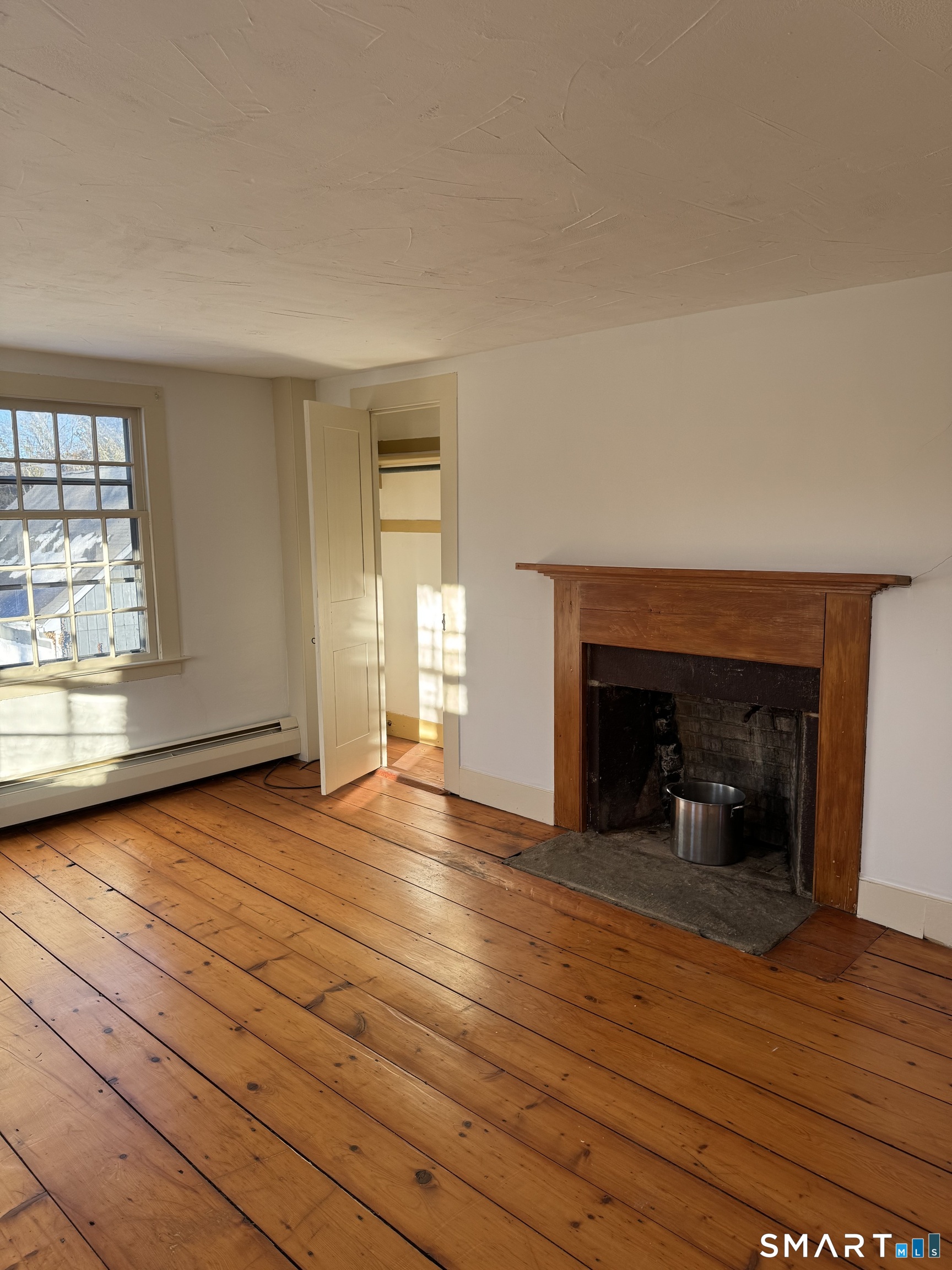 30 Hopyard Road East Haddam, CT 06423 - Photo 7 of 42 wooden floor fireplace and windows in an empty room