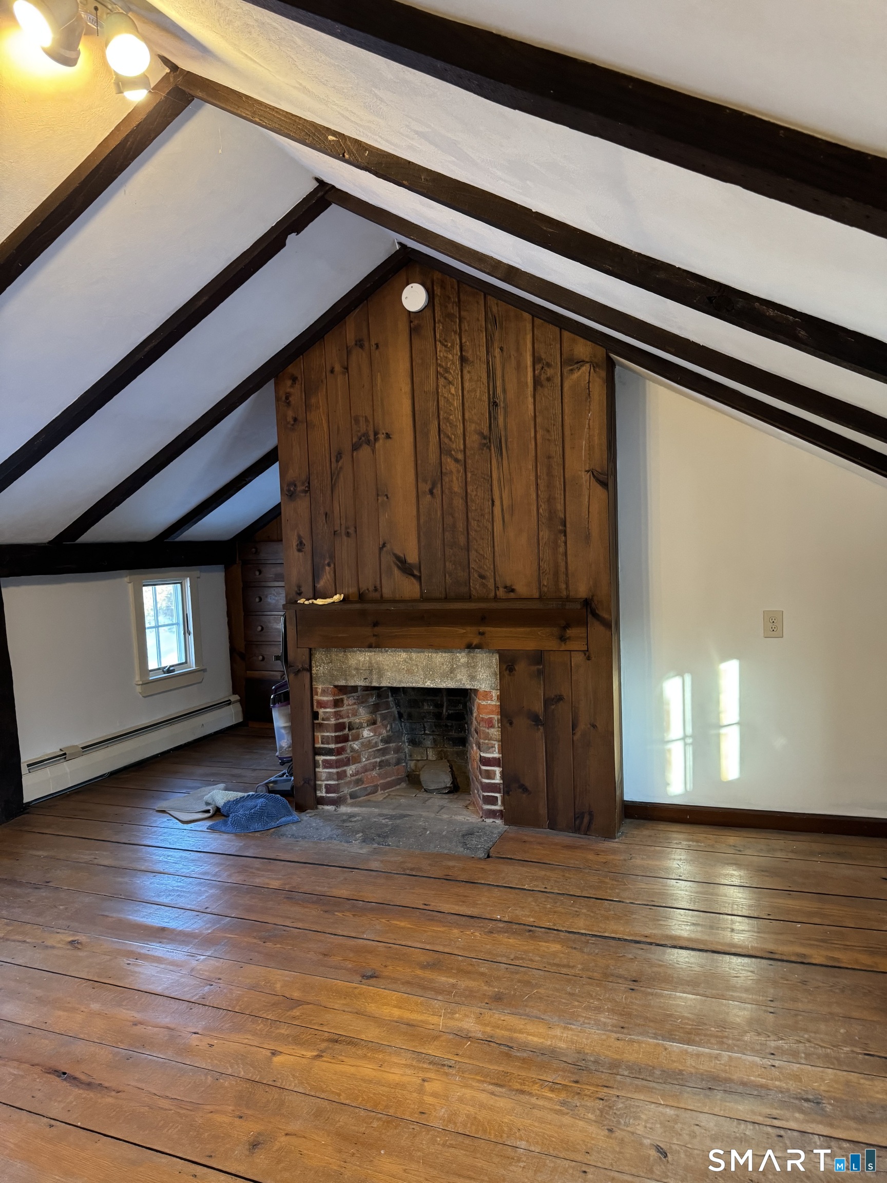 30 Hopyard Road East Haddam, CT 06423 - Photo 10 of 42 a view of a livingroom with a fireplace and window