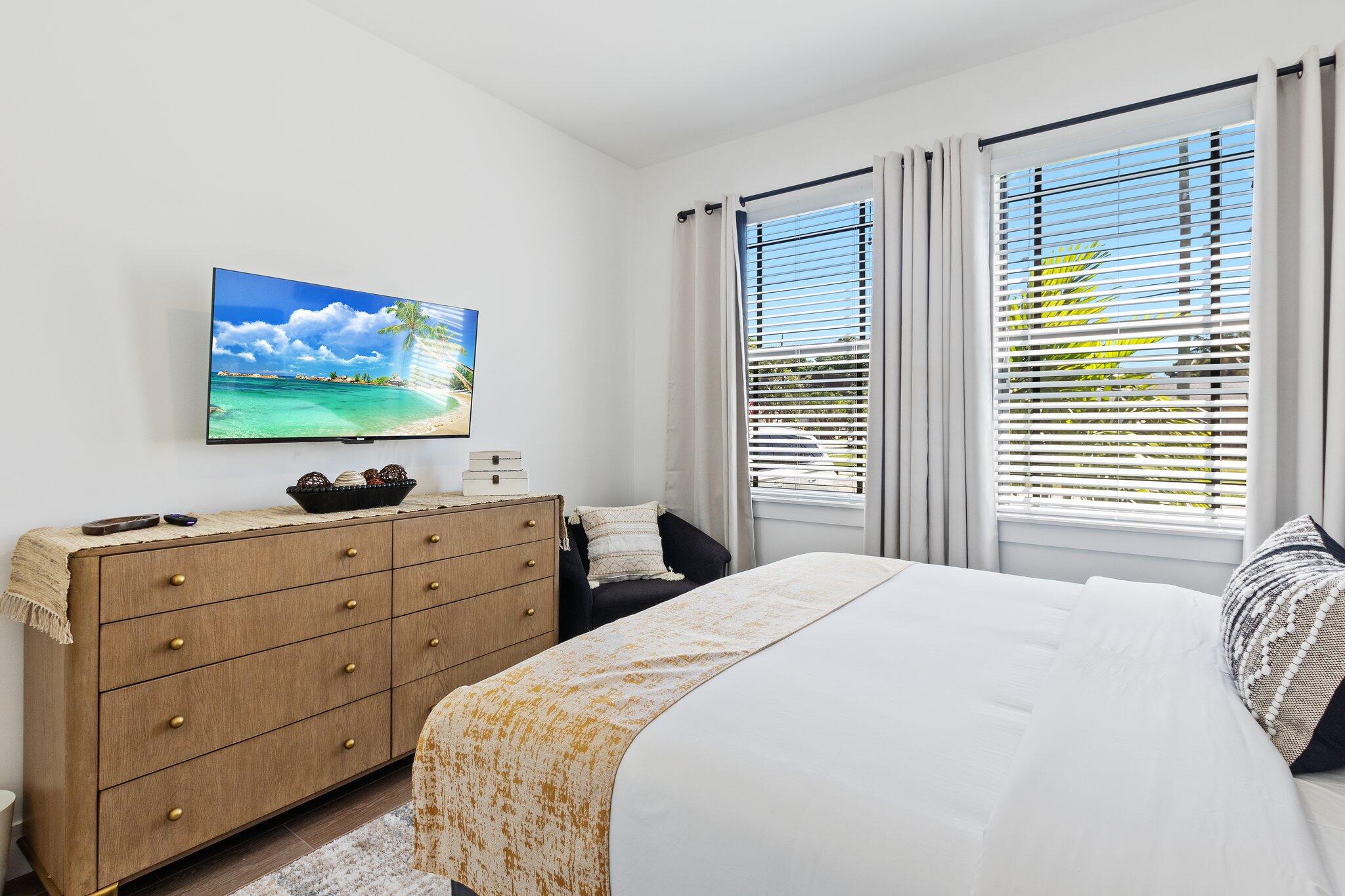 601 Southwest 3rd Street Delray Beach, FL 33444 - Photo 29 of 75 a bedroom with a bed and a flat screen tv
