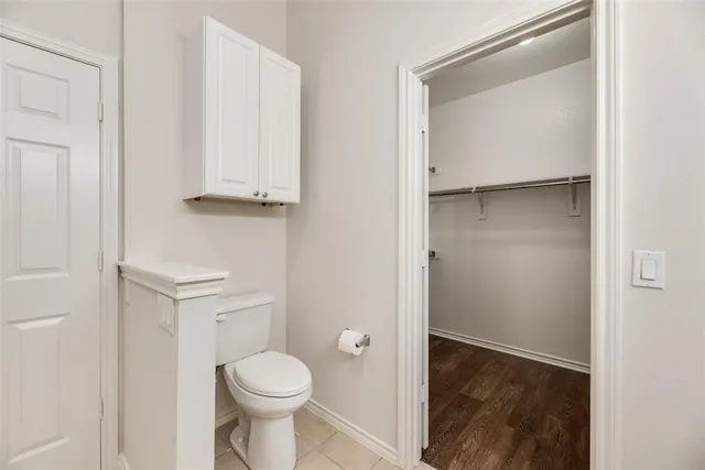 a bathroom with a toilet and a sink