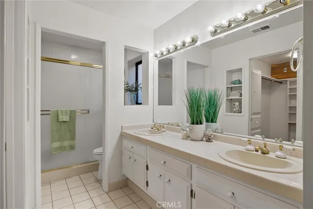 a bedroom with a bed and a table in it