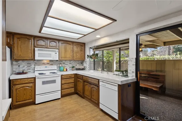 a kitchen with a stove sink and cabinets