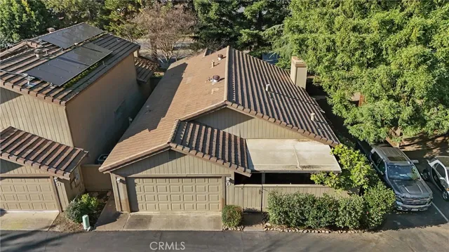a backyard of a house with outdoor seating
