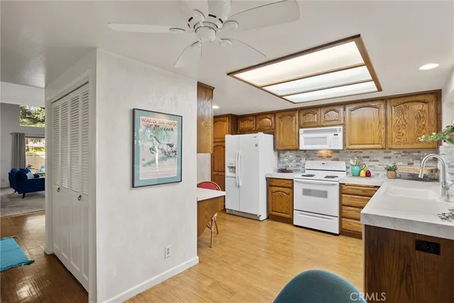 a kitchen with a refrigerator stove and sink