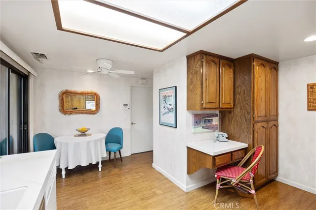 a view of a livingroom with furniture and a window