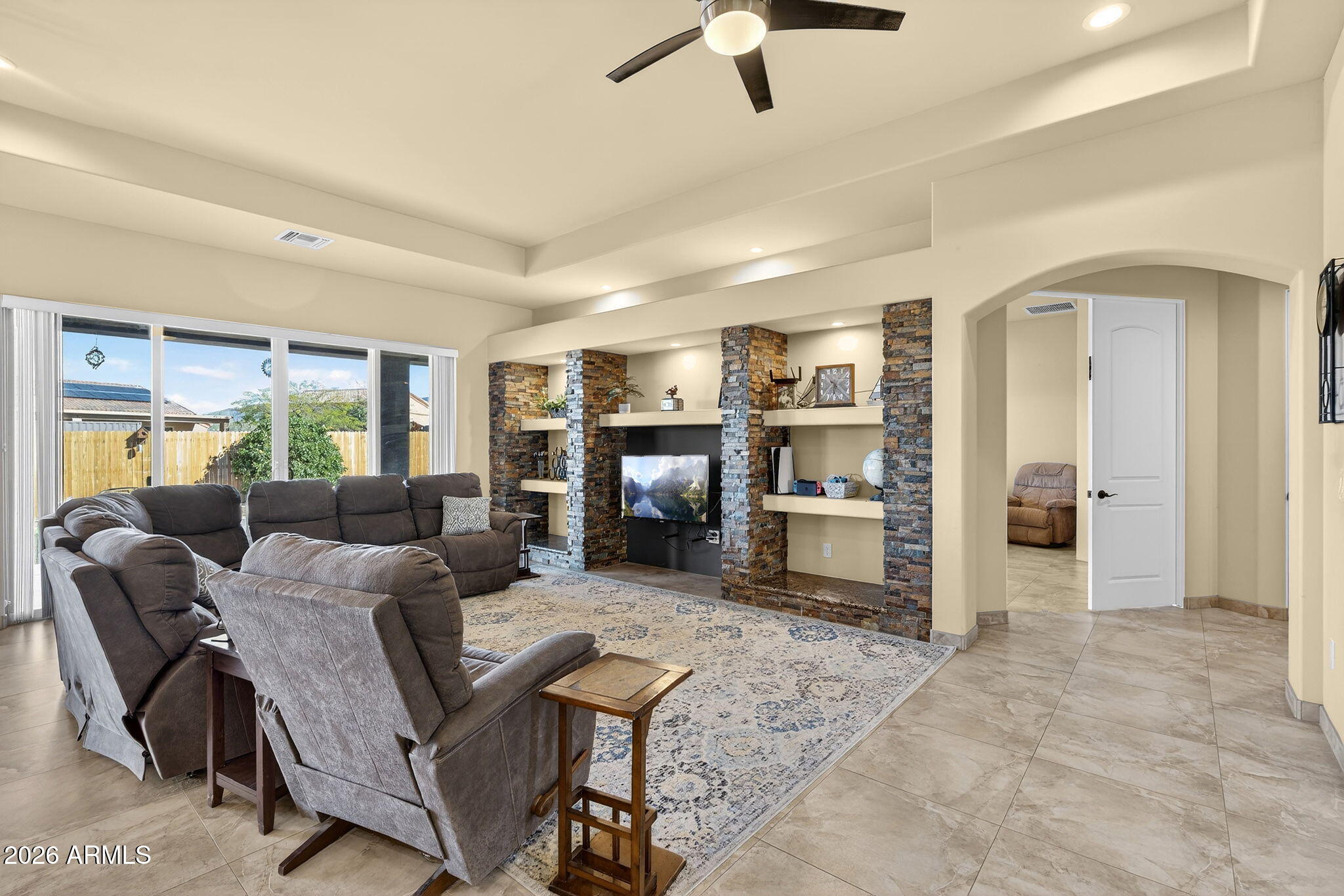 112 West Circle Mountain Road New River, AZ 85087 - Photo 26 of 57 a living room with furniture and a kitchen view