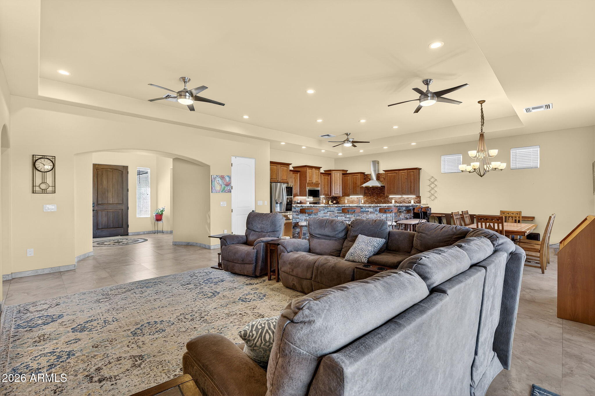 112 West Circle Mountain Road New River, AZ 85087 - Photo 27 of 57 a living room with furniture kitchen view and a chandelier