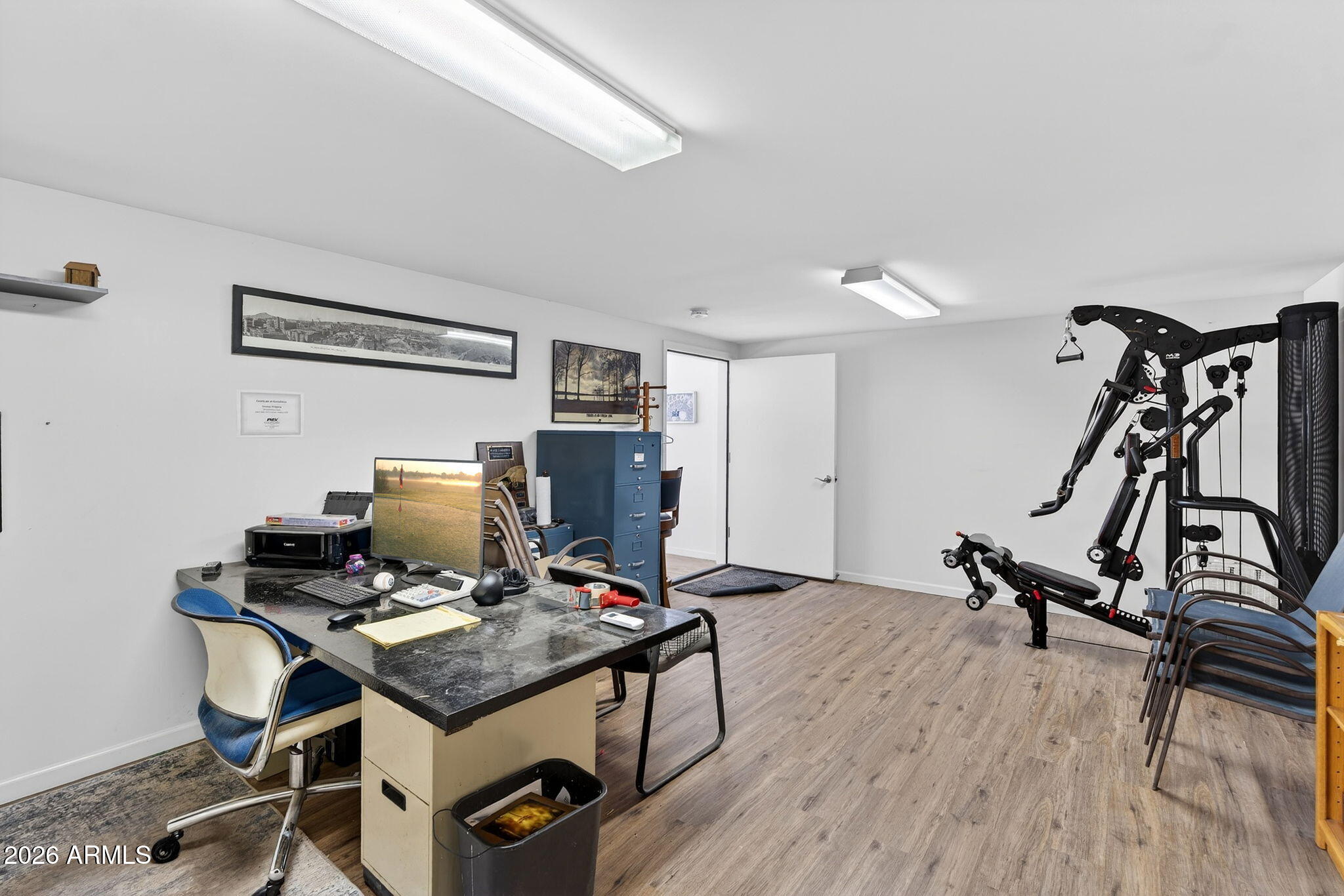 112 West Circle Mountain Road New River, AZ 85087 - Photo 41 of 57 a view of a workspace with furniture and wooden floor