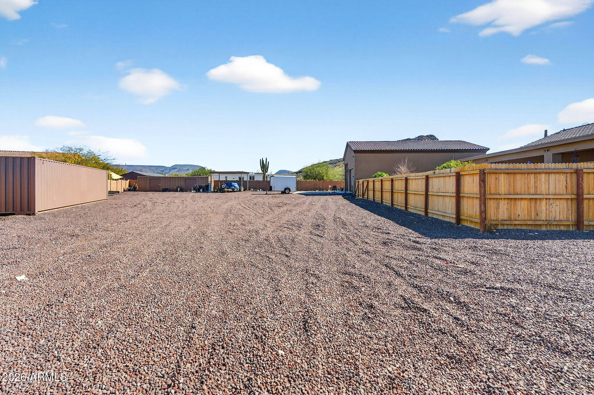 112 West Circle Mountain Road New River, AZ 85087 - Photo 52 of 57 a view of a dry yard with wooden fence