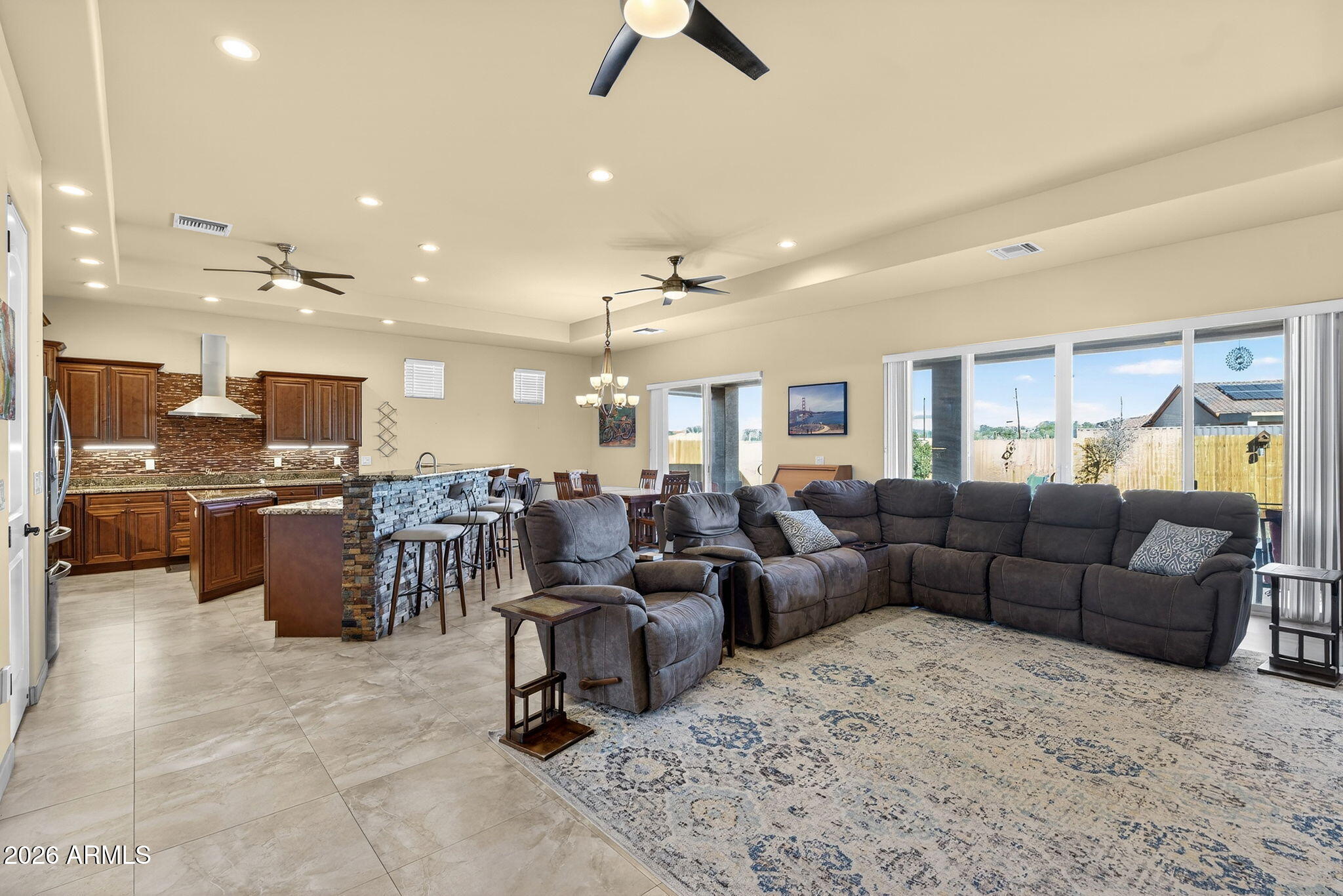 112 West Circle Mountain Road New River, AZ 85087 - Photo 4 of 57 a living room with furniture kitchen view and a chandelier