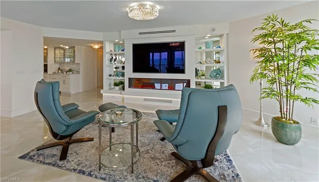 a living room with furniture and a rug