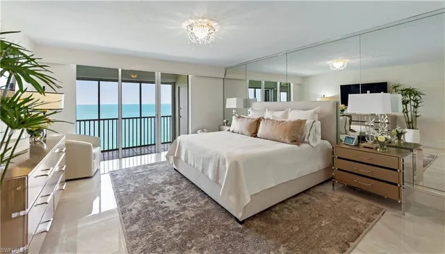 a bedroom with a bed and a tv