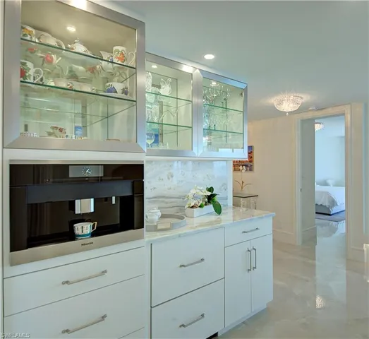 a kitchen with a cabinets and window