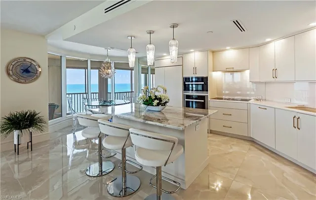 a kitchen with a table and chairs in it