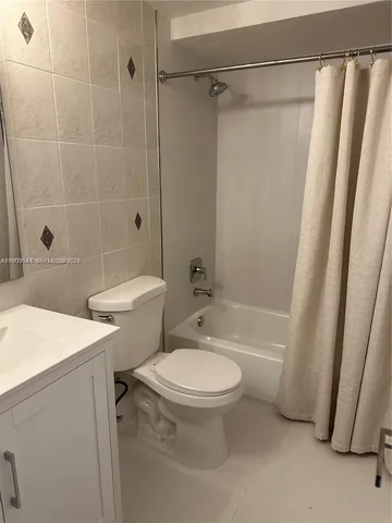 a kitchen with granite countertop a sink and a stove