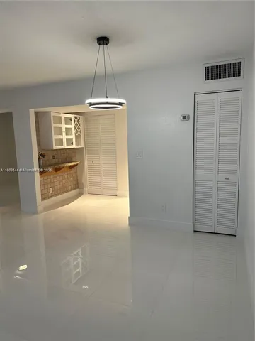 a bathroom with a sink a mirror and vanity