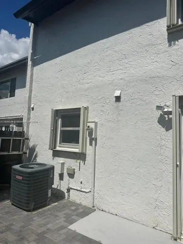 a view of a lake with houses in the back