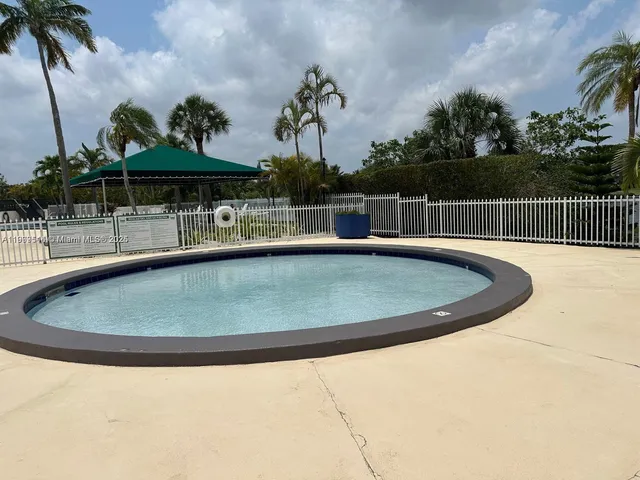 a view of a lake with houses in the background