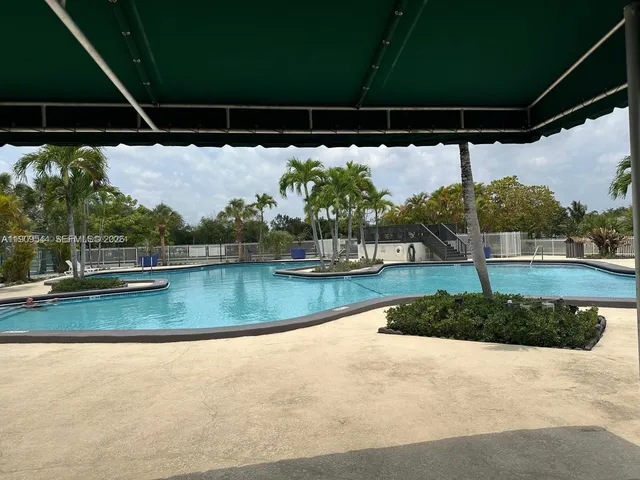 a view of a lake with houses in the background