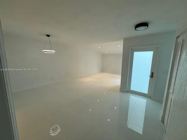 a view of a kitchen with a sink