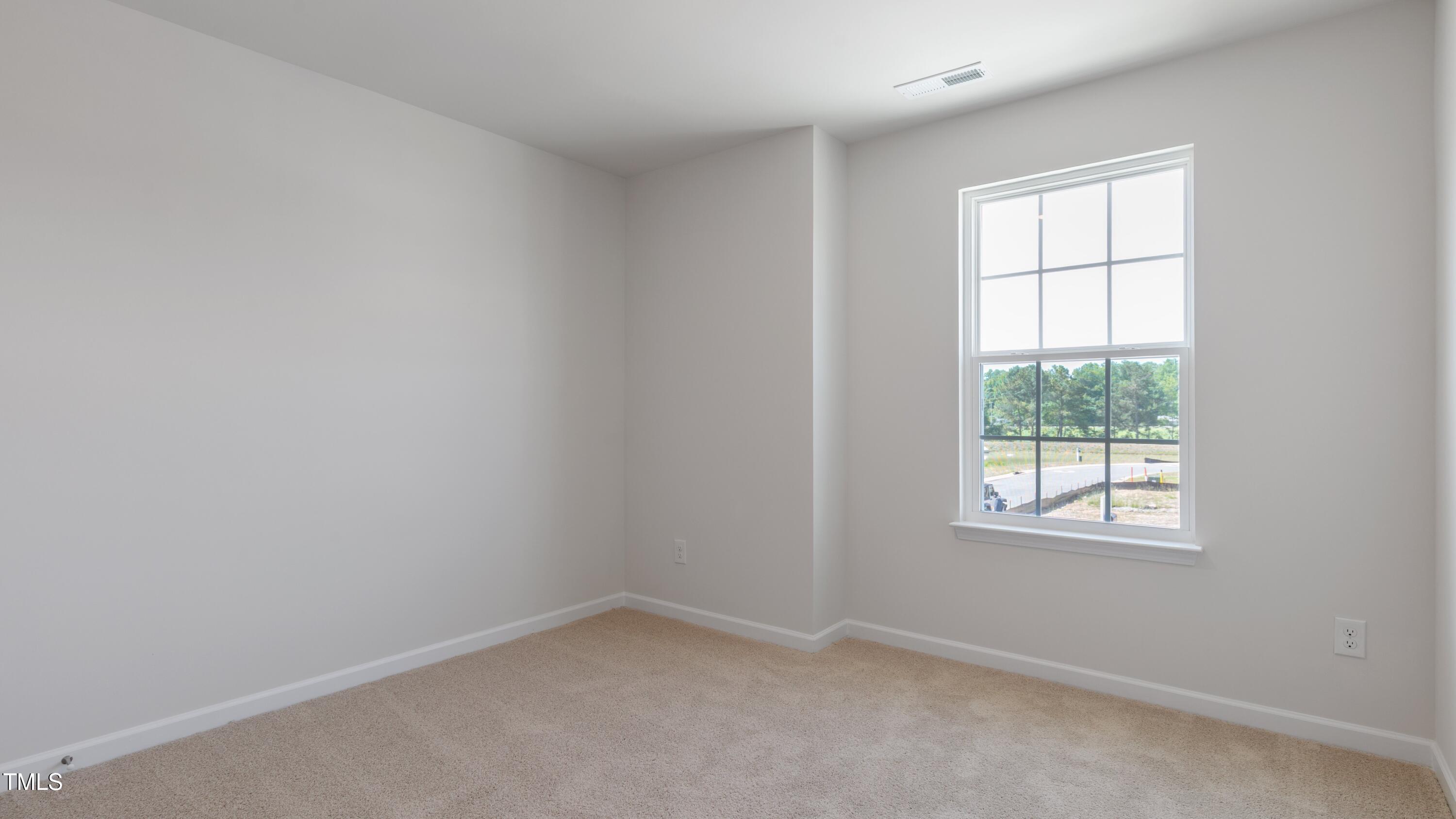 39 Virgo Drive Angier, NC 27501 - Photo 18 of 31 an empty room with a window