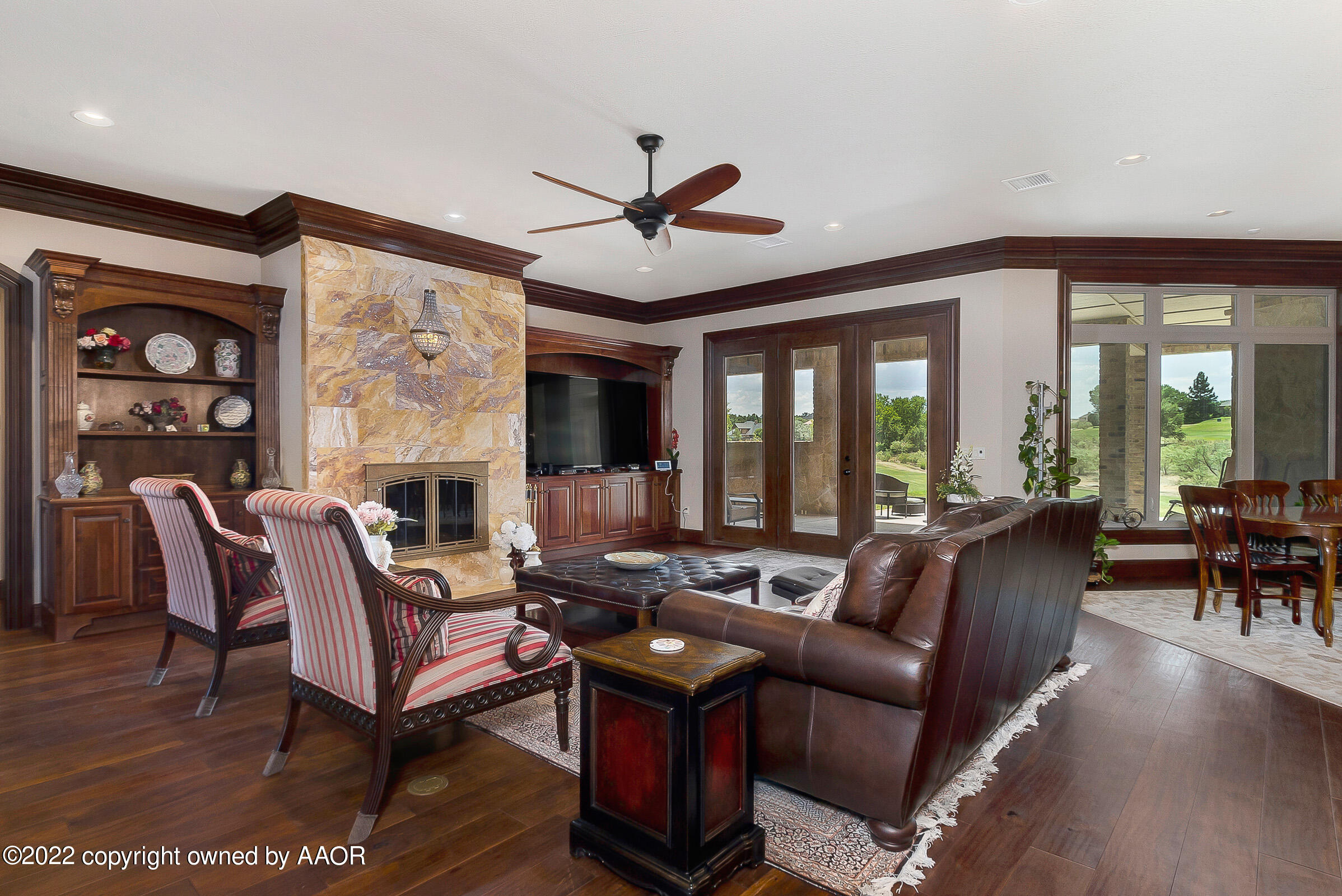 16 Merion Place Amarillo, TX 79124 - Photo 17 of 71 a living room with furniture a fireplace and a large window
