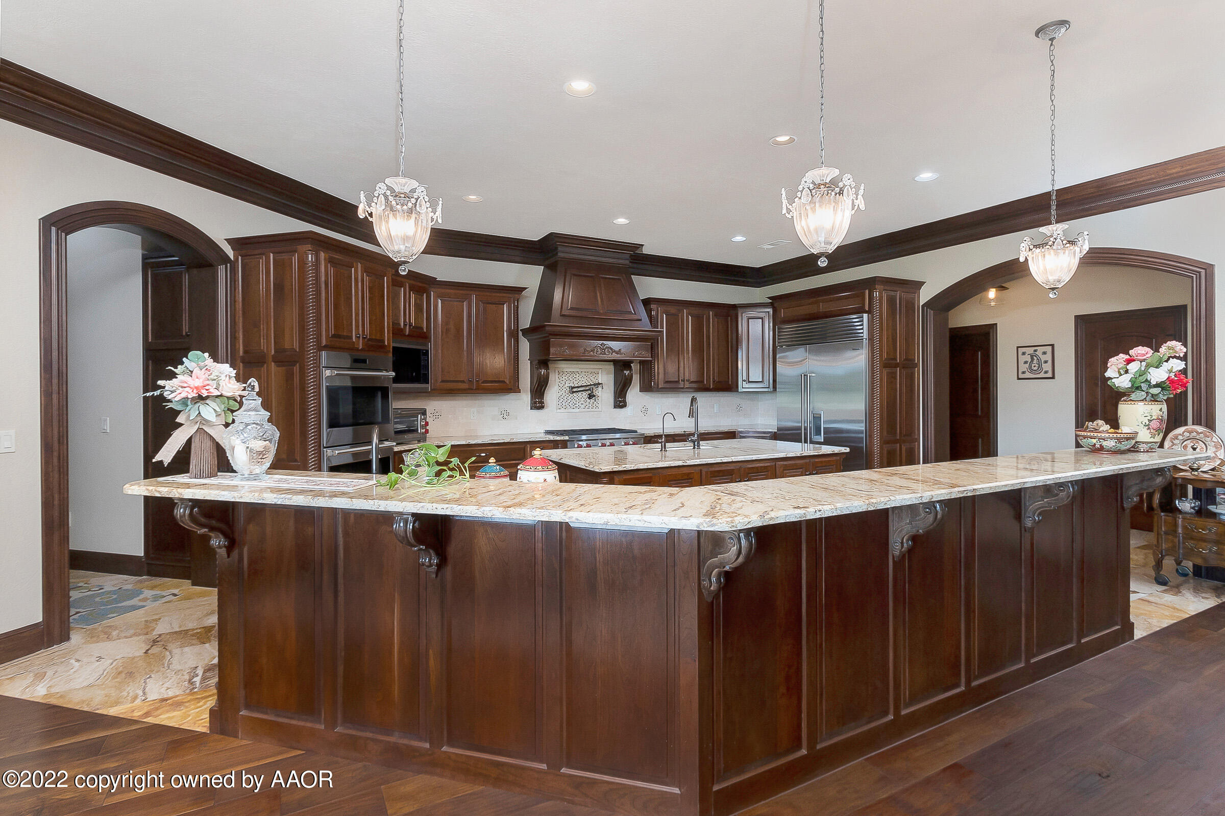 16 Merion Place Amarillo, TX 79124 - Photo 22 of 71 a kitchen with stainless steel appliances granite countertop a sink a stove and a wooden floors