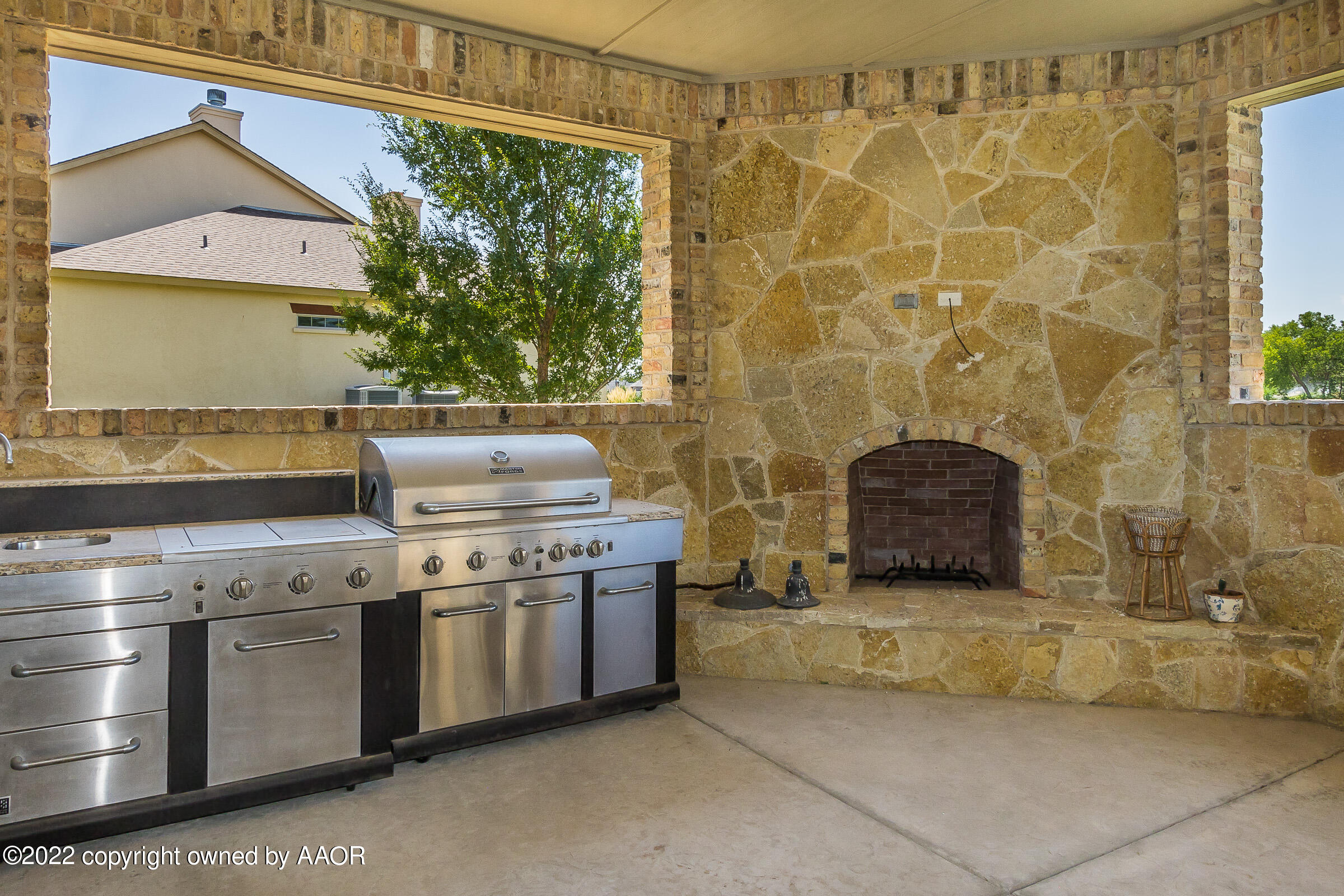 16 Merion Place Amarillo, TX 79124 - Photo 25 of 71 a kitchen with granite countertop a stove and a shower