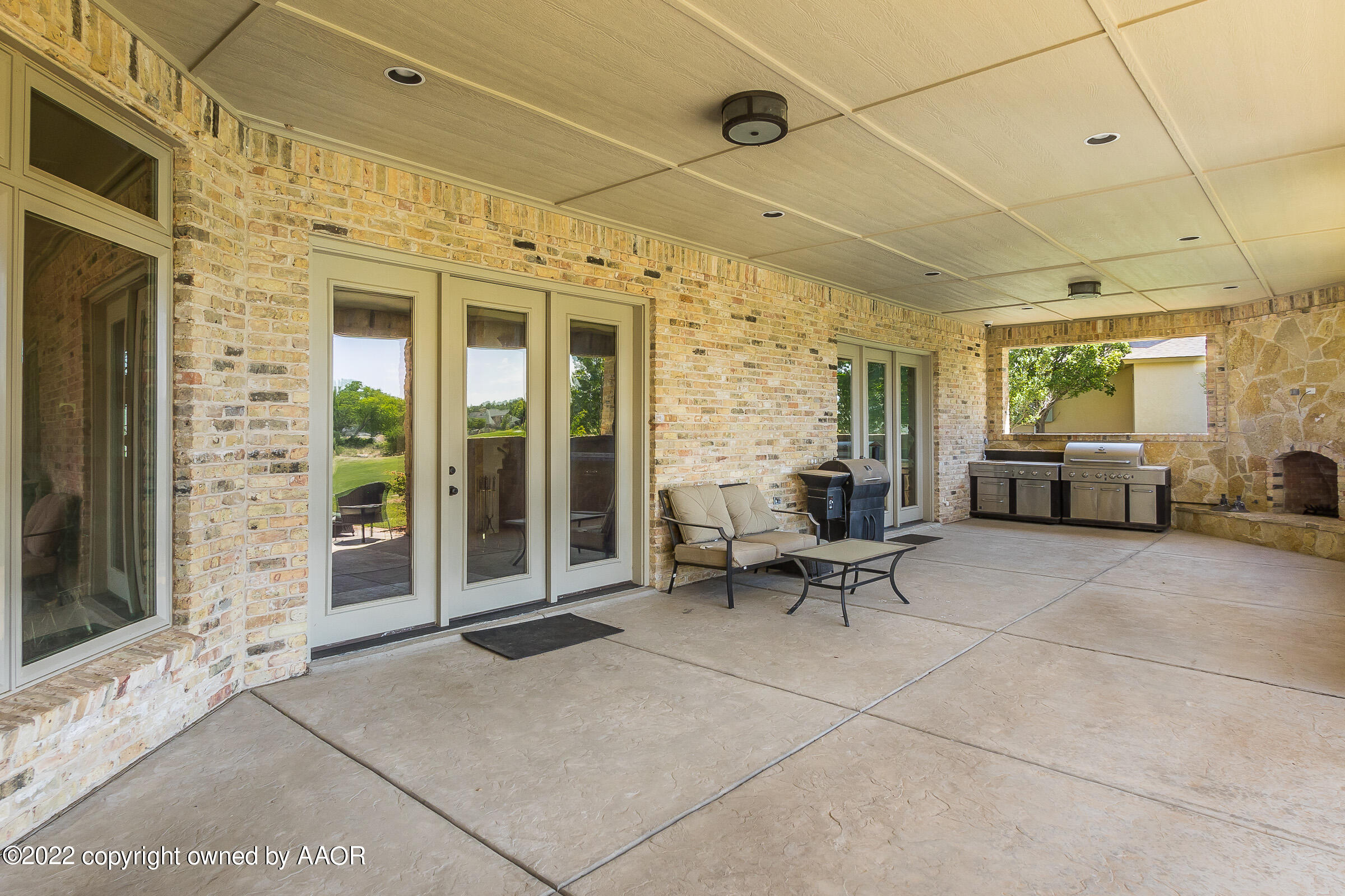16 Merion Place Amarillo, TX 79124 - Photo 26 of 71 a view of a patio with a table and chairs and potted plants